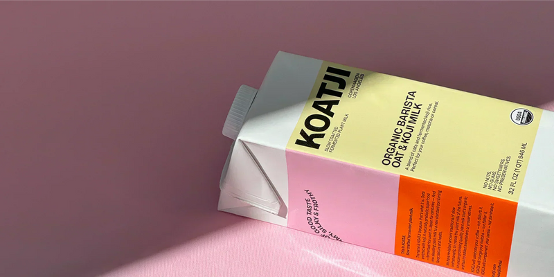 Koatji organic barista oat milk carton on a soft pink background with clean, minimal packaging.